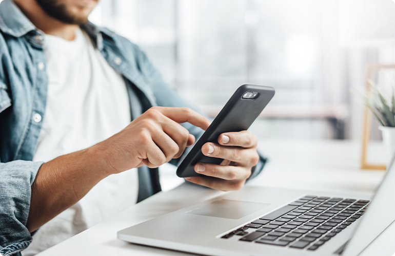 Young man with smartphone in his hands.